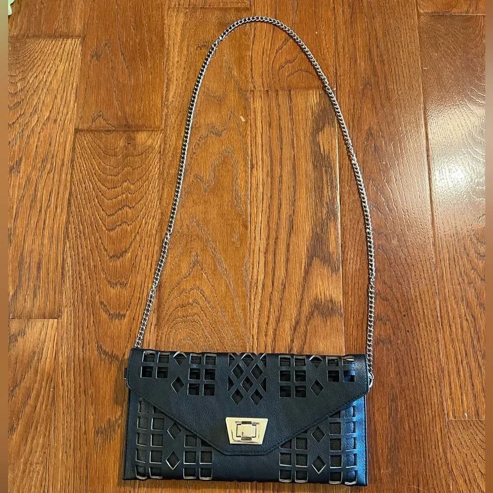 Black faux leather laser cut out fashion purse with gold tone hardware